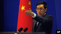 China's Foreign Ministry spokesman Liu Weimin gestures during a news conference in Beijing (file photo).