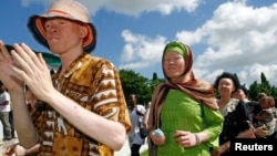 FILE - Participants march towards Mnazi Mmoja grounds during Tanzania Albino Day celebrations in Dar es Salaam.