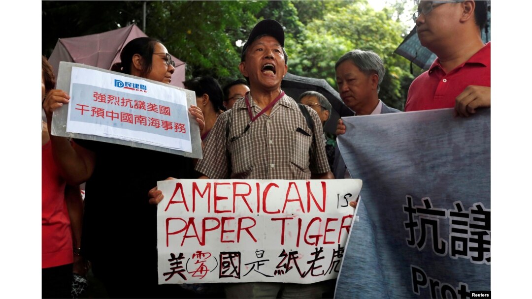 A protester from a local pro-China party chants slogans against the United States supporting an international court ruling that denied China's claims to the South China Sea, outside U.S. Consulate in Hong Kong, China July 14, 2016.