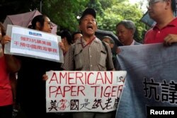 A protester from a local pro-China party chants slogans against the United States supporting an international court ruling that denied China's claims to the South China Sea, outside U.S. Consulate in Hong Kong, China July 14, 2016.