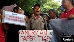 A protester from a local pro-China party chants slogans against the United States supporting an international court ruling that denied China's claims to the South China Sea, outside U.S. Consulate in Hong Kong, China July 14, 2016. 