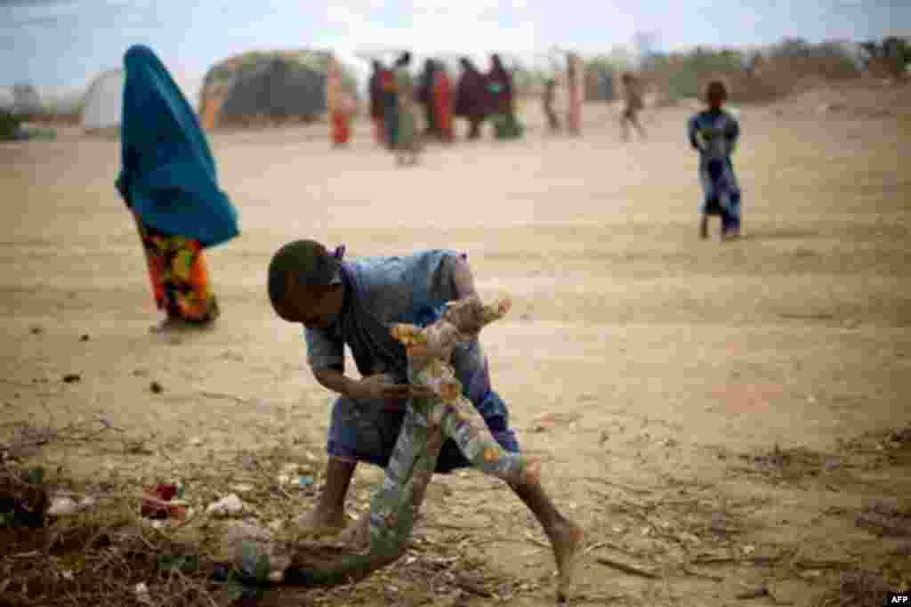 A SOmali child plays at UNHCR's Ifo Extention camp outside Dadaab, Eastern Kenya, 100 kms (60 miles) from the Somali border, Saturday Aug. 6, 2011. The drought and famine in the horn of Africa has killed more than 29,000 children under the age of 5 i