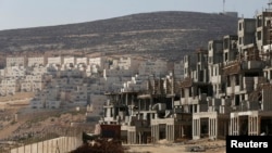 FILE - A construction site is seen in the West Bank Jewish settlement of Givat Zeev, near Jerusalem.