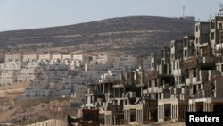 FILE - A construction site is seen in the West Bank Jewish settlement of Givat Zeev, near Jerusalem.