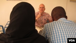 UNICEF's Grev Lester Hunt meets with Ebola survivors who are forming a support group in Conakry, Guinea, on Sept. 29, 2014. 