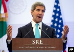 U.S. Secretary of State John Kerry gestures as he speaks during a joint news conference with Mexican Foreign Secretary Jose Antonio Meade in Mexico City, May 21, 2014.