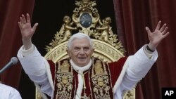 Pope Benedict XVI delivers his "Urbi et Orbi" (to the City and to the World) speech from the central loggia of St. Peter's Basilica, at the Vatican, Dec. 25, 2012.