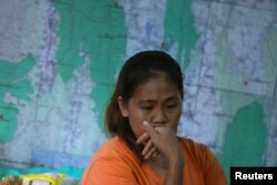 A relative of the 12 boys and their soccer coach trapped in the Tham Luang cave complex listens to a news conference about the death of a Thai rescue diver after he fell unconscious during part of an operation, near the cave complex in the northern province of Chiang Rai, Thailand, July 6, 2018.