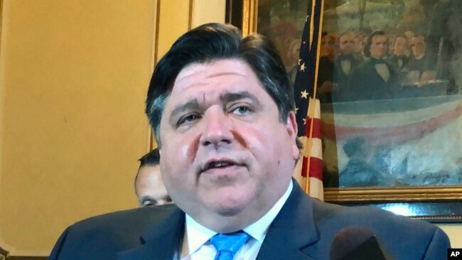 FILE - Gov. J.B. Pritzker announces that applications to grow industrial hemp in Illinois for the first time in 80 years are available online, at a news conference April 30, 2019, in Springfield, Ill. The governor said May 4, 2019, that he's reached an agreement with key lawmakers on a plan to legalize recreational marijuana in the state starting next year.