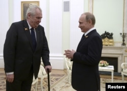 Czech Republic President Milos Zeman, left, talks to Russian President Vladimir Putin during their meeting at the Kremlin in Moscow, May 9, 2015.