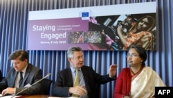 International Labor Organization (ILO) Director-General Guy Ryder (L), EU trade commissioner Karel De Gucht and Bangladeshi Foreign Minister Dipu Moni attend a meeting in Geneva with employee, industry and employer representatives