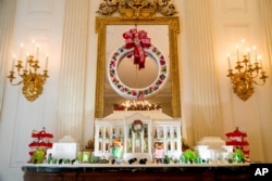 This year's White House Gingerbread House in the State Dining Room of the White House during a preview of the 2016 holiday decor at the White House, Tuesday, Nov. 29, 2016, in Washington.