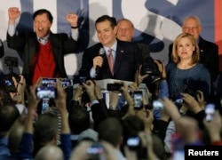 U.S. Republican presidential candidate Ted Cruz speaks, with his wife, Heidi Cruz, by his side, after winning at his Iowa caucus night rally in Des Moines, Iowa, United States, Feb. 1, 2016.