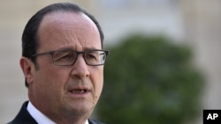 French President Francois Hollande delivers a speech after a high-level security meeting at the Elysee Palace in Paris, June 26, 2015.