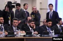Mohammad Alloush (C), the head of the Syrian opposition delegation, attends Syria peace talks in Astana, Kazakhstan, Jan. 23, 2017.