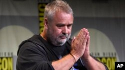 FILE - Director/producer/writer Luc Besson attends the "Valerian and the City of a Thousand Planets" panel at Comic-Con International in San Diego, July 21, 2016.