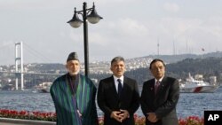 Presidents Hamid Karzai of Afghanistan, left, Abdullah Gul of Turkey, center, and Asif Ali Zardari of Pakistan pose for media in Istanbul, November 1, 2011.