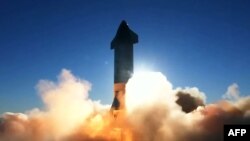 This SpaceX video frame grab image shows SpaceX's Starship SN8 rocket prototype taking off at the company's Boca Chica, Texas facility during an attempted high-altitude launch test on December 9, 2020. (Photo by - / SPACEX / AFP) 