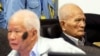 FILE - Khieu Samphan (l), former Khmer Rouge head of state, and Nuon Chea, Khmer Rouge's chief ideologist and No. 2 leader, sit in the court room before they made closing statements at the U.N.- backed war crimes tribunal in Phnom Penh, Oct. 31, 2013. 