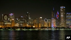 FILE - A nighttime view of the Chicago skyline, after the city's Cubs won the World Series in 2016. 