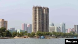 FILE - View from the Taedong River of the construction of apartment buildings for faculty members of Kim Ch'aek University of Technology in this undated photo released by North Korea's Korean Central News Agency (KCNA) in Pyongyang, May 21, 2014. 