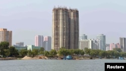 FILE - View from the Taedong River of the construction of apartment buildings for faculty members of Kim Ch'aek University of Technology in this undated photo released by North Korea's Korean Central News Agency (KCNA) in Pyongyang, May 21, 2014. 