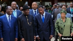 FILE - Ivory Coast's President Alassane Ouattara (L), Nigeria's President Goodluck Jonathan (2nd L), Benin's President Thomas Yayi Boni and Liberia President Ellen Johnson Sirleaf (R) are pictured at the 43rd (ECOWAS) Summit. 