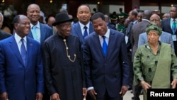 FILE - Ivory Coast's President Alassane Ouattara (L), Nigeria's President Goodluck Jonathan (2nd L), Benin's President Thomas Yayi Boni and Liberia President Ellen Johnson Sirleaf (R) are pictured at the 43rd Economic Community of West African States (ECOWAS).