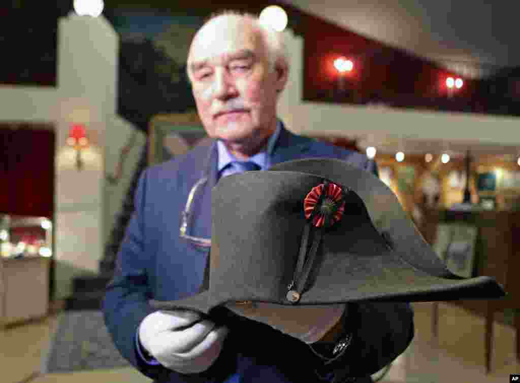 Napoleon expert Jean Claude Dey presents Napoleon's hat from the Napoleonic collection of the Palais de Monaco, in Fontainebleau, south of Paris. The collection, gathered by Prince Louis II, will go on sale next week.