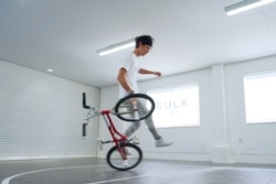 Takahiro Ikeda, 31, breaks the new Guinness World Record for "Most BMX Stick B in 30 seconds" in Chiba, Japan October 20, 2021. (Courtesy of Guinness World Records 2021/Masakazu Senda/Handout via REUTERS)