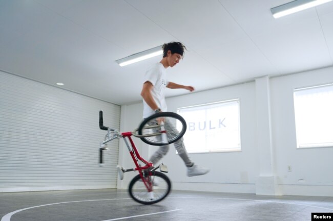 Takahiro Ikeda, 31, breaks the new Guinness World Record for "Most BMX Stick B in 30 seconds" in Chiba, Japan October 20, 2021. (Courtesy of Guinness World Records 2021/Masakazu Senda/Handout via REUTERS)