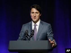 Canada's Prime Minister Justin Trudeau addresses a session at the second day of the National Governors Association meeting, July 14, 2017, in Providence, Rhode Island.