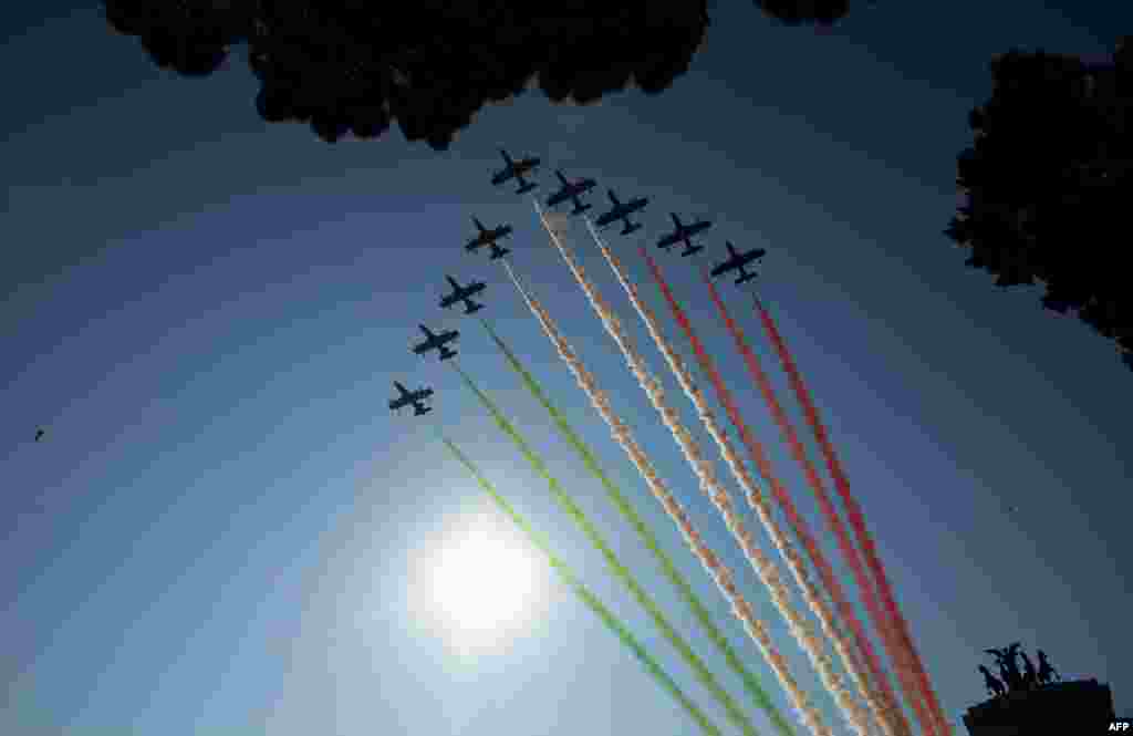 Green, white and red smoke in the colours of the Italian flag are left in the sky of Rome by the Italian Air Force aerobatic unit &#39;Frecce Tricolori&#39; marking the anniversary of Italian national unification in Rome.