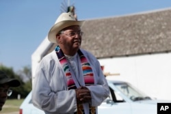 In this Aug. 12, 2017, photo, Father Roy Snipes is shown after he led a procession to the La Lomita Chapel along a levee toward the Rio Grande to oppose the wall the U.S. government wants to build on the river separating Texas and Mexico in Mission, Texas.