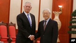 U.S. Secretary of Defense Jim Mattis, left, shakes hands with Vietnam's Communist Party General Secretary Nguyen Phu Trong before holding talks in Hanoi, Vietnam, Jan. 25, 2018.