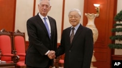 U.S. Secretary of Defense Jim Mattis, left, shakes hands with Vietnam's Communist Party General Secretary Nguyen Phu Trong before holding talks in Hanoi, Vietnam, Jan. 25, 2018.