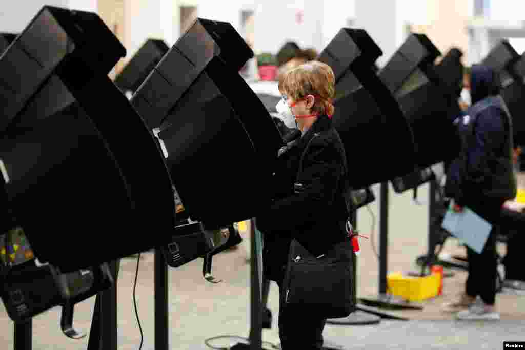 Voters cast their ballots for the presidential primary elections at the Franklin County Board of Election office in Columbus, Ohio.