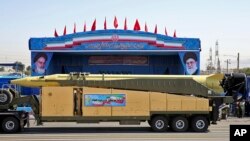 An Emad long-range ballistic surface-to-surface missile, seen in this Sept. 21, 2016 file photo, is displayed by the Revolutionary Guard during a military parade, in front of the shrine of late revolutionary founder Ayatollah Khomeini, just outside Tehran, Iran.