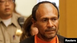 FILE - Jose Ines Garcia Zarate, arrested in connection with the July 1, 2015, shooting of Kate Steinle on a pier in San Francisco, enters the Hall of Justice for his arraignment in San Francisco, July 7, 2015.