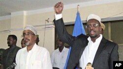 Somalia president Sharif Sheik Ahmed, right, speaks, during the first session in parliament since he named the new prime minister, Mohamed Abdullahi Mohamed. Speaker of Parliament Sherif Hassan Sheik Adan, is at left, in Parliament hall, Mogadishu, Somali