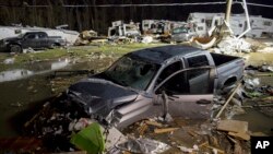 Destroyed trailers and vehicles are all that remain of the Sugar Hill RV Park after a suspected tornado hit the park in Convent, La., Tuesday, Feb. 23, 2016. 