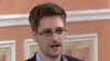 In this image made from video released by WikiLeaks, former National Security Agency systems analyst Edward Snowden speaks during a presentation ceremony in Russia, Oct. 11, 2013. 