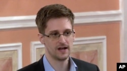 FILE - In this image made from video released by WikiLeaks on Oct. 11, 2013, former National Security Agency systems analyst Edward Snowden speaks during a presentation ceremony in Russia. 