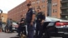 Law enforcement personnel continue probing for details into Thursday’s ambush of police officers at a demonstration in Dallas, Texas, July 9, 2016. (G. Tobias/VOA News) 