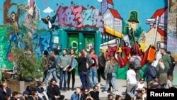 People attend a street party in Goerlitzer Park, marking the May Day in the Kreuzberg district in Berlin, Germany, May 1, 2018. 