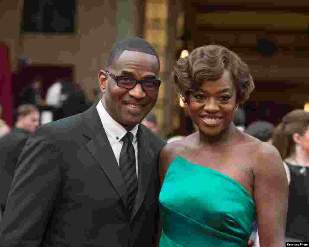 Julius Tennon (left) and Viola Davis arrive for the live ABC Telecast of The 86th Oscars® on March 2, 2014 in Hollywood, CA. (Photo courtesy AMPAS)