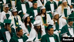 FILE- Reynolds High School students at their graduation ceremony. The Civil Rights Project at UCLA says persistent segregation is worst in northern and western states. (REUTERS/Steve Dipaola)