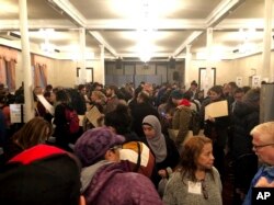 People stand in numerous lines as they wait to vote at Kingsboro Temple Seventh-day Adventist Church in the Brooklyn borough of New York, Nov. 6, 2018. The malfunctioning equipment turned a polling place in Brooklyn’s Park Slope neighborhood into a “mosh pit,” said Brad Lander, a New York City councilman.