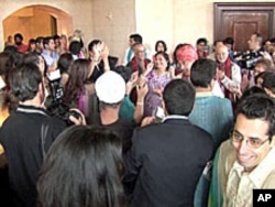 Guests at the wedding of groom Tarun Gulrajani and bride Preeti Gurnani celebrate during a lavish reception at Florida's Gaylord Palms resort in Orlando, September 2010