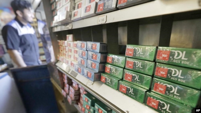 FILE - This May 17, 2018 file photo shows packs of menthol cigarettes and other tobacco products at a store in San Francisco. On Thursday, April 29, 2021, the Food and Drug Administration pledged again to try to ban menthol cigarettes, this time under pre